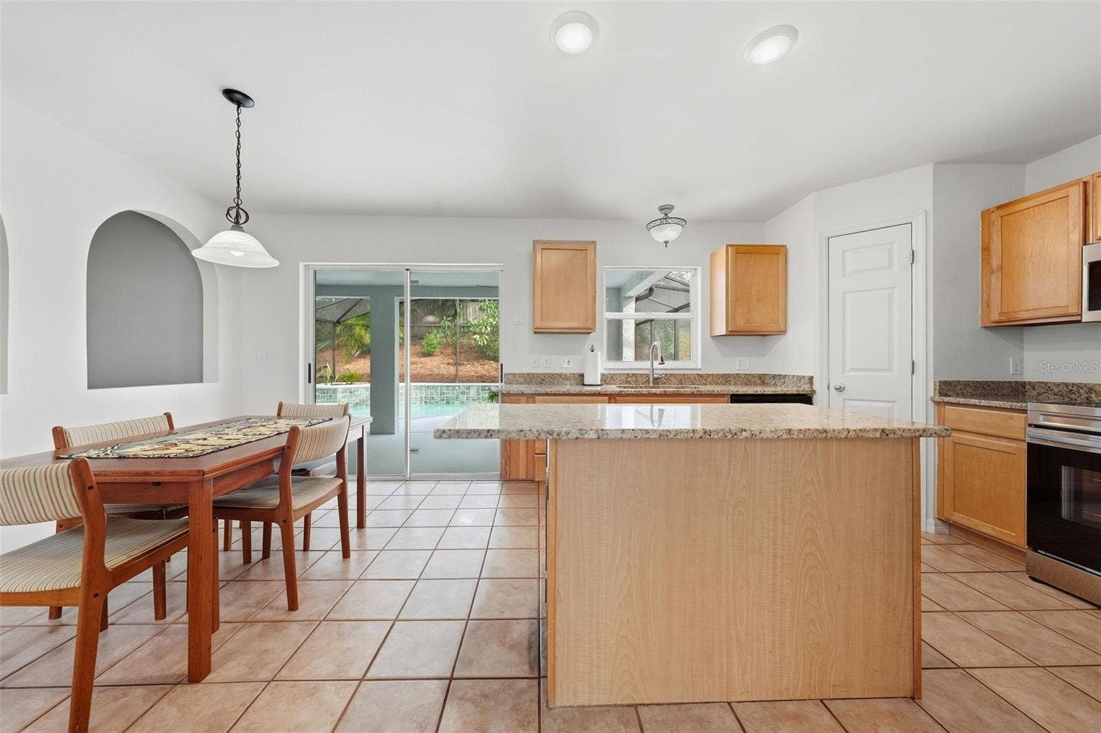 Breakfast Room and Kitchen Opens to Pool Area