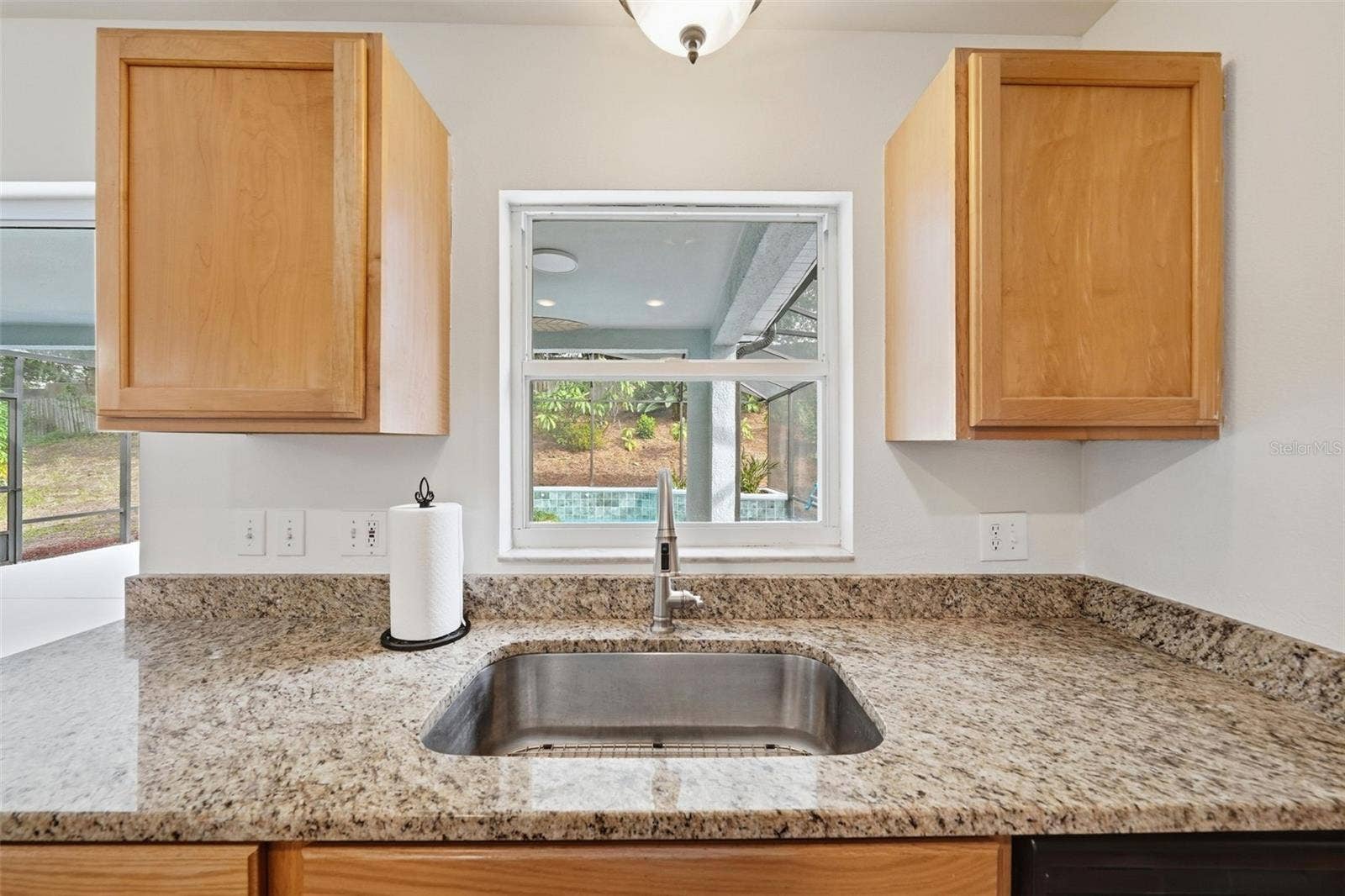 Kitchen Sink overlooking the Lanai and Pool