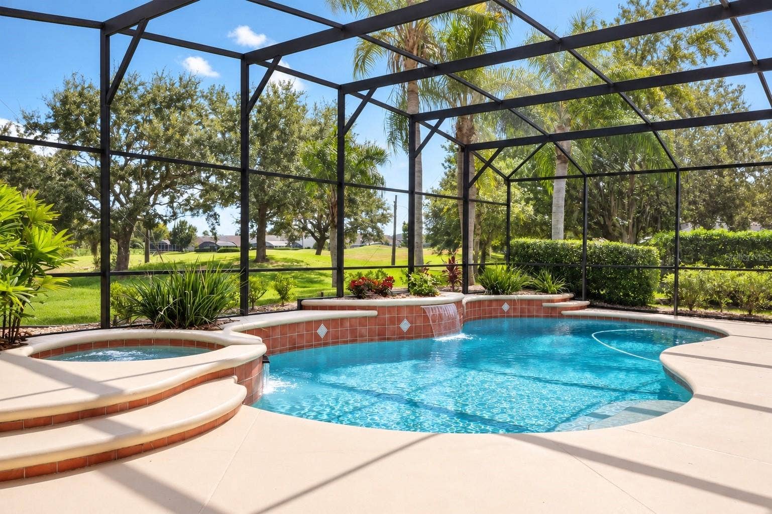 STUNNING SCREEN-ENCLOSED POOL AND EXPANSIVE OUTDOOR LIVING AREA! Enjoy breathtaking views of lush tropical landscaping and peaceful green space with NO REAR NEIGHBORS! The spacious covered lanai overlooks the sparkling pool, creating the perfect setting for morning coffee, entertaining guests, or relaxing while enjoying Florida's beautiful year-round weather. YOUR OWN PRIVATE BACKYARD PARADISE!