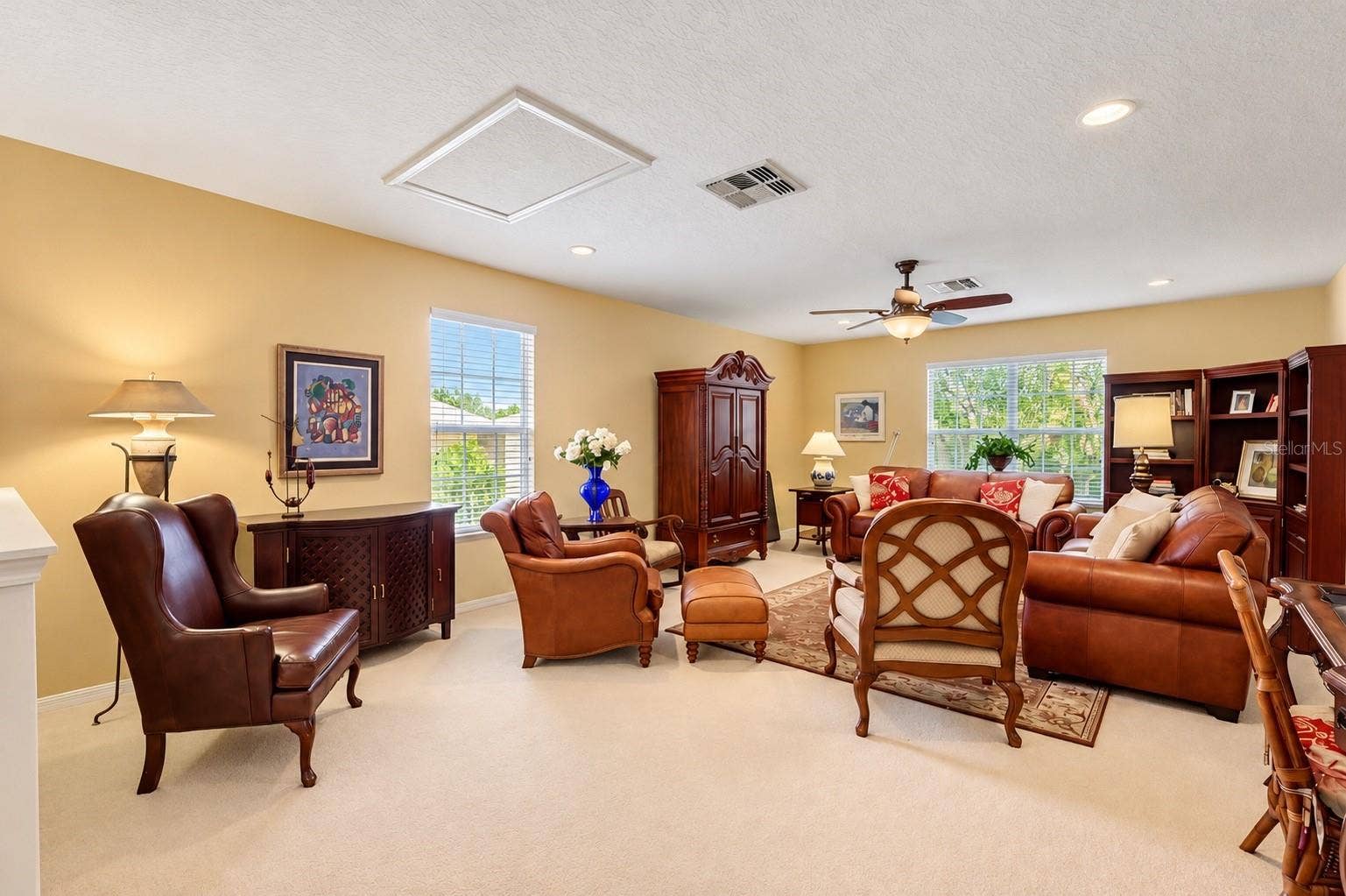 HUGE UPSTAIRS BONUS ROOM, THE ONLY ROOM ON THE SECOND FLOOR, OFFERING INCREDIBLE FLEXIBILITY AS A MEDIA ROOM, GAME ROOM, HOME OFFICE, OR PRIVATE RETREAT!