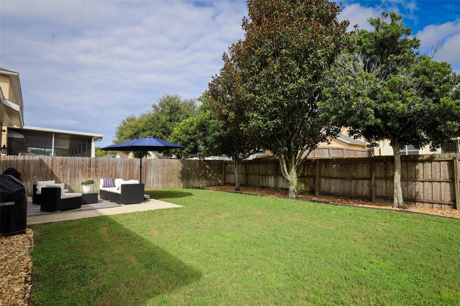 Oversized back yard, fully fenced with extra slap recently poured for entertainment and possibly a gazebo.  (Footers were poured if you ever want a gazebo)