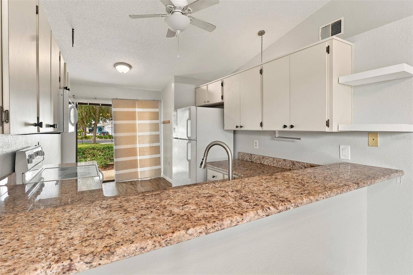 480 LANDING BOULEVARD, Inverness, FL 34450 Kitchen counter and breakfast nook seating area