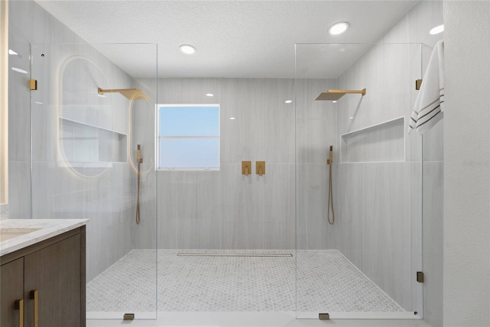 13044 BELLERIVE LANE, Orlando, FL 32828 Oversized walk-in shower with largeporcelain tile and dual rainfall heads