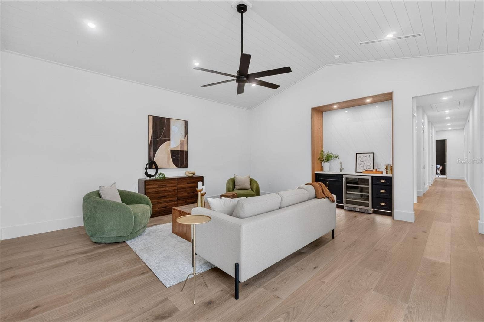 1815 WINDERMERE ROAD, Windermere, FL 34786 Game room features a wet bar with beverage refrigerator and two large sliding glass doors that provide direct access to pool and covered lanai