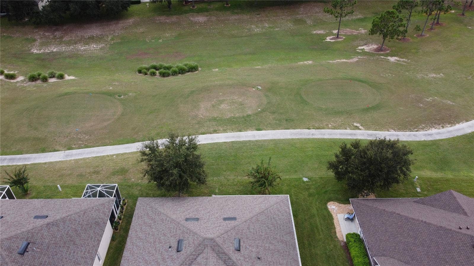 26942 WHITE PLAINS WAY, Leesburg, FL 34748 Drone Pic Of Roof & Golf Course