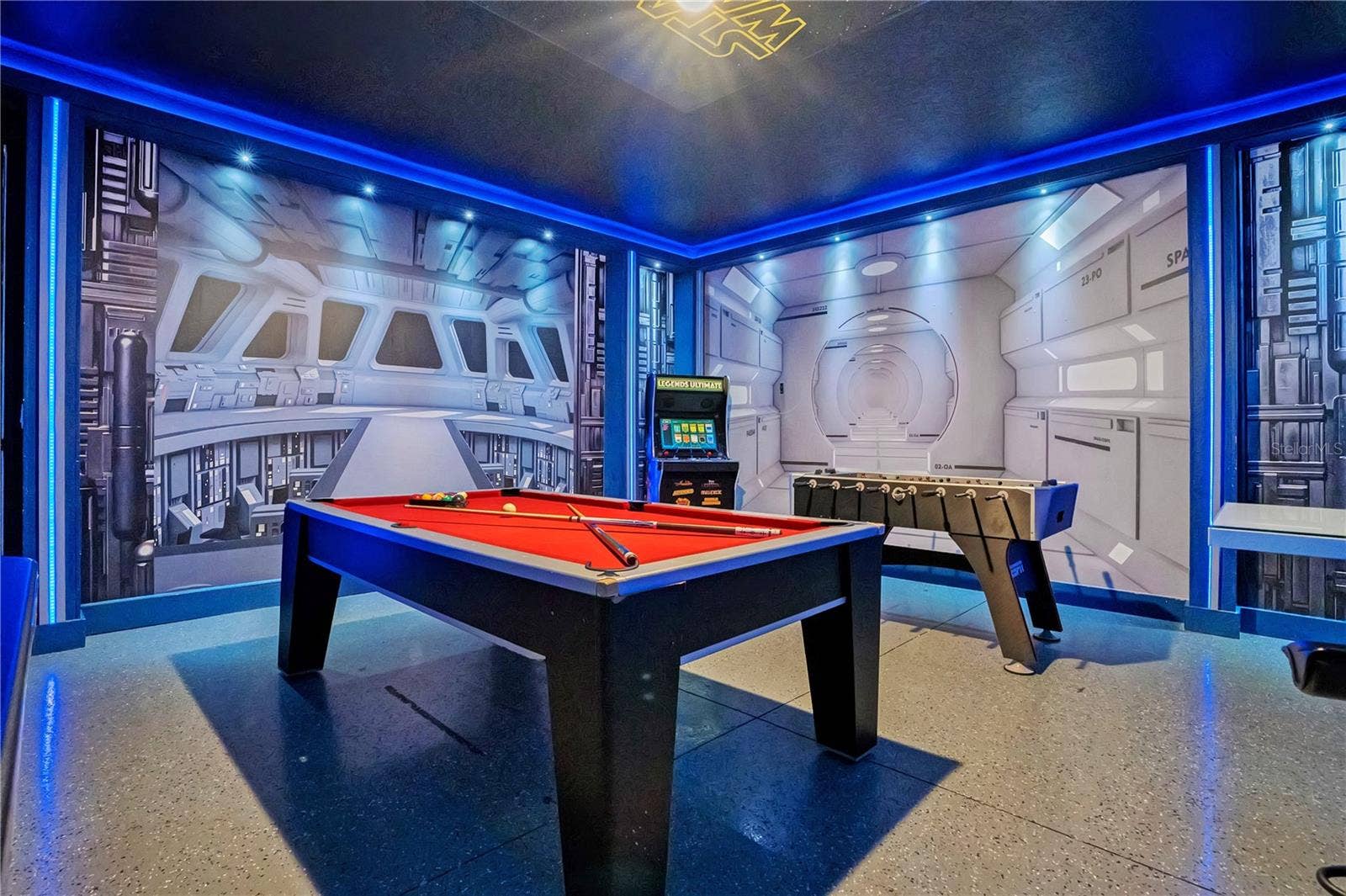 7704 WESTLAND DRIVE, Kissimmee, FL 34747 The Galactic Arcade - an immersive Star Wars-inspired game room with billiards and custom lighting