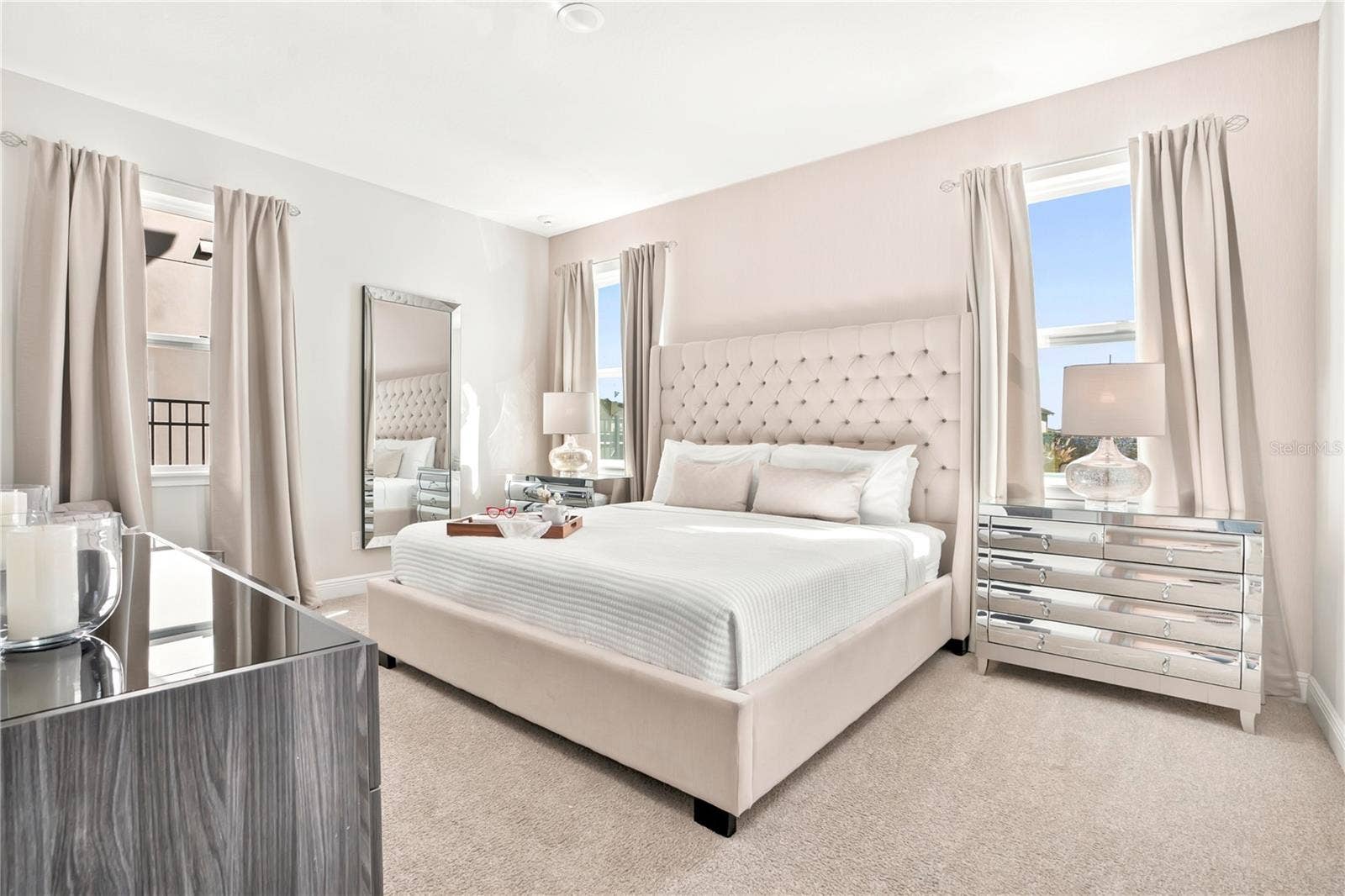 7704 WESTLAND DRIVE, Kissimmee, FL 34747 The first floor elegant primary suite with soft neutrals and timeless designer furnishings