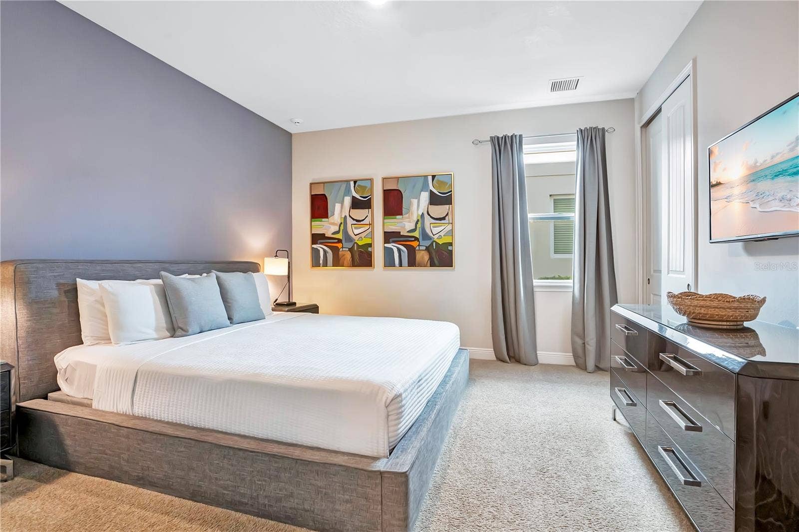 7704 WESTLAND DRIVE, Kissimmee, FL 34747 A welcoming 1st floor guest suite with understated finishes, comfortable furnishings, and natural light
