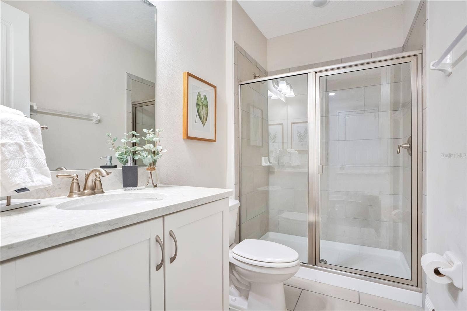 7704 WESTLAND DRIVE, Kissimmee, FL 34747 Private en-suite bathroom to the American Girl Retreat provides added comfort and convenience