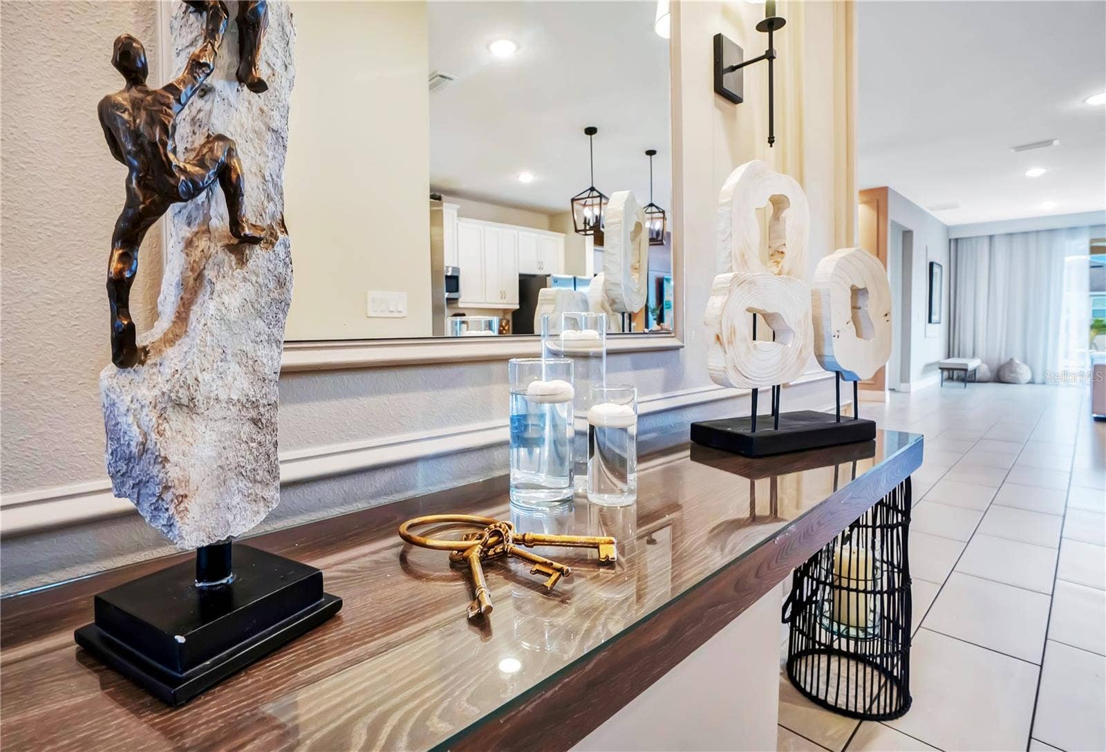 7704 WESTLAND DRIVE, Kissimmee, FL 34747 Thoughtfully curated furnishings, artwork, and decorative accents elevate every detail of this beautifully designed residence
