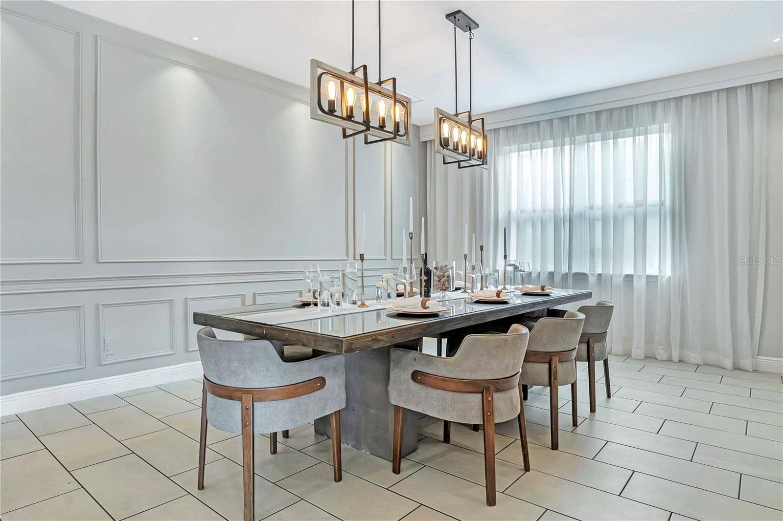 7704 WESTLAND DRIVE, Kissimmee, FL 34747 An elegant dining experience with sophisticated architectural detailing, statement lighting, and generous space for memorable meals together