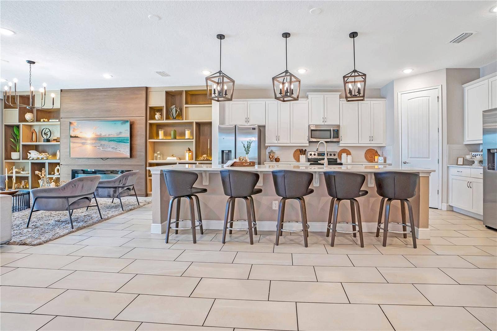 7704 WESTLAND DRIVE, Kissimmee, FL 34747 Open, inviting, and exceptionally functional - designed to bring everyone together.