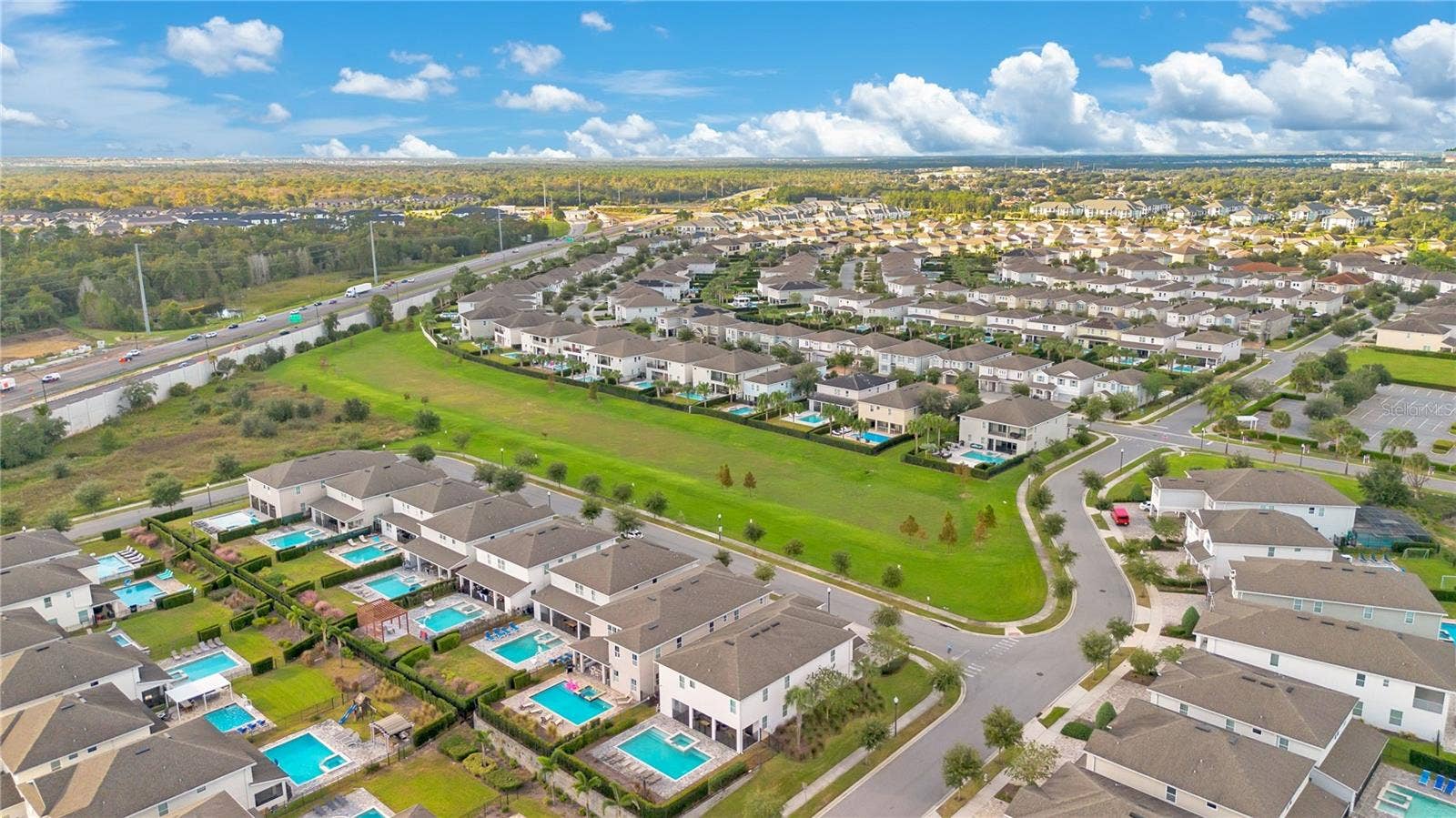 7704 WESTLAND DRIVE, Kissimmee, FL 34747 Aerial perspective of Encore at Reunion's expansive resort community