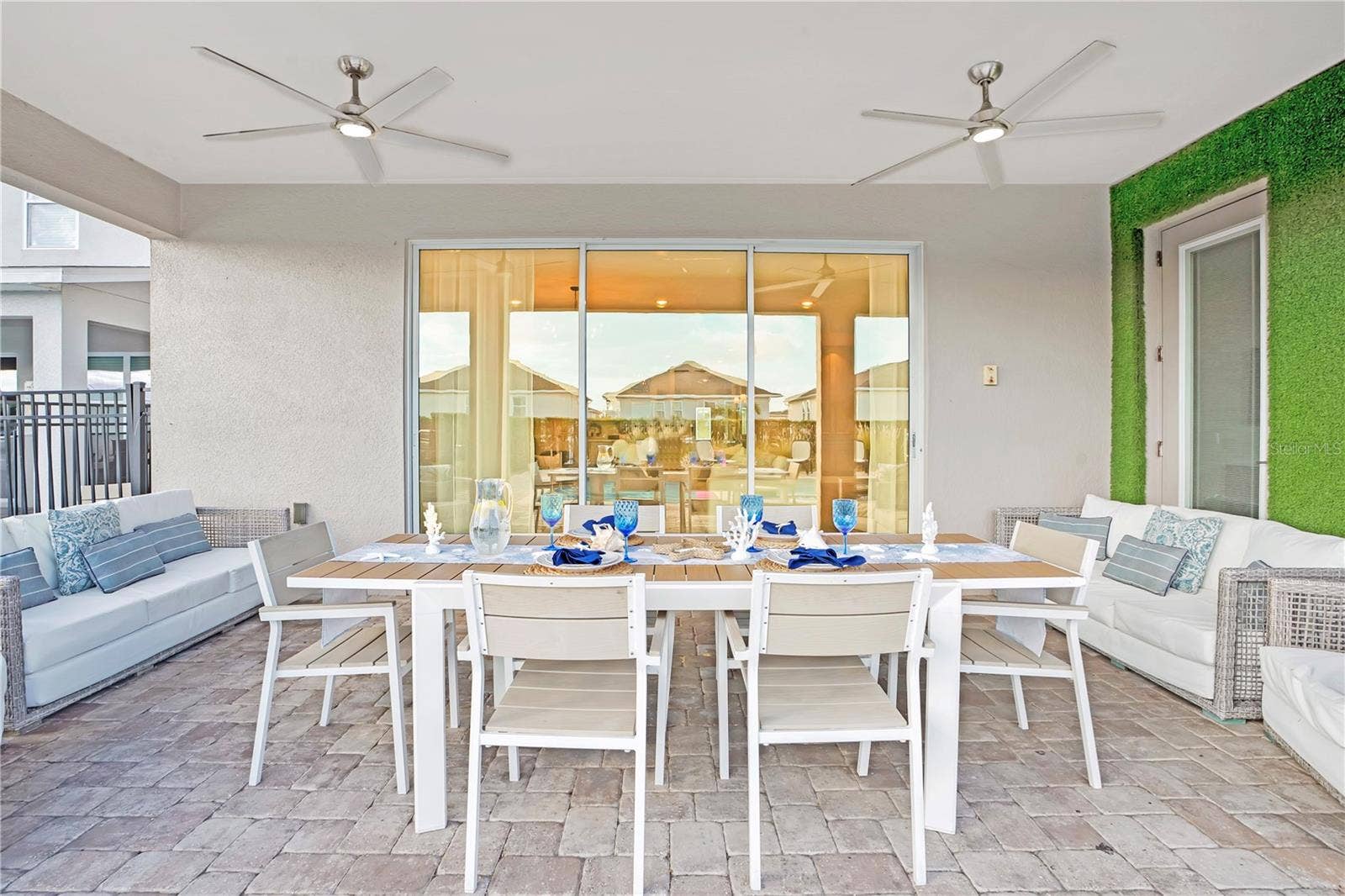 7704 WESTLAND DRIVE, Kissimmee, FL 34747 An inviting outdoor gathering space, perfect for dining al fresco