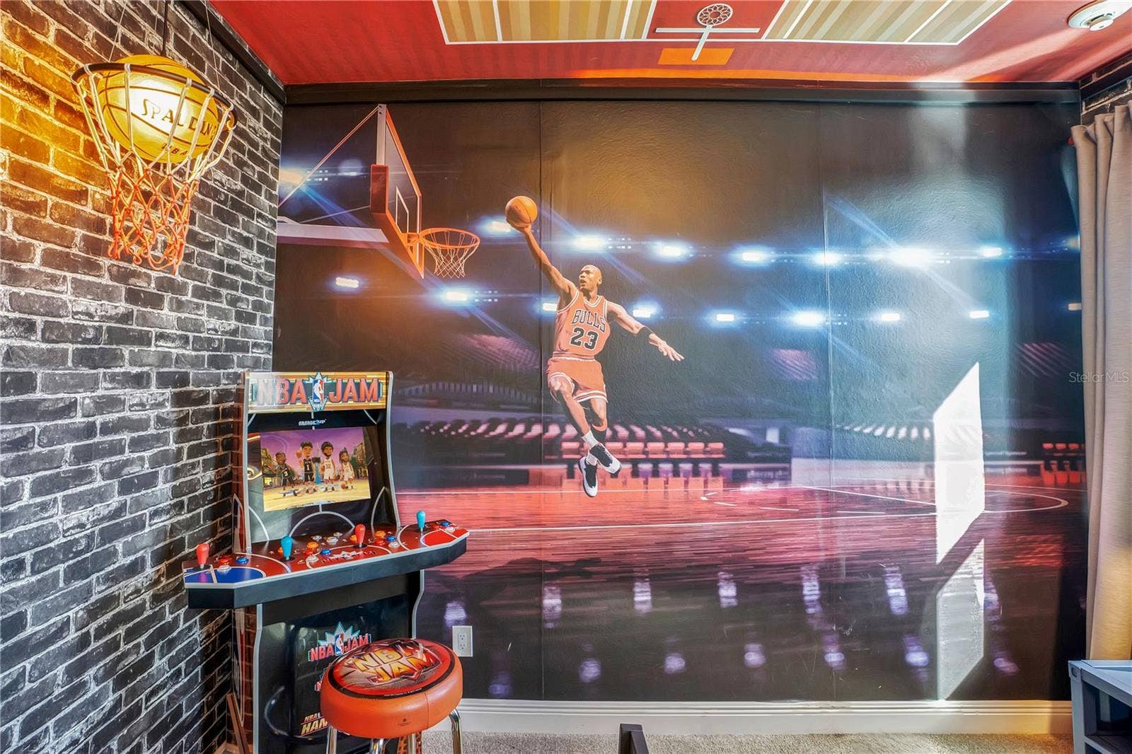 7704 WESTLAND DRIVE, Kissimmee, FL 34747 Courtside inspiration! Custom basketball murals bring the energy of the game into this themed retreat