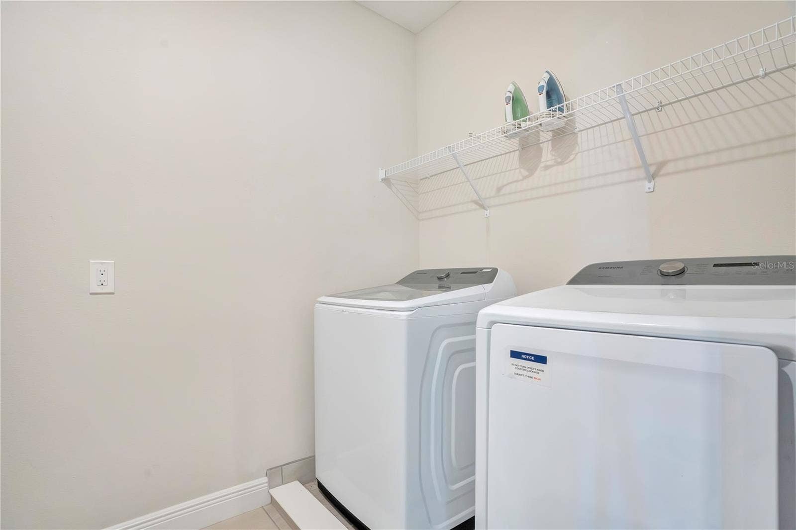 7704 WESTLAND DRIVE, Kissimmee, FL 34747 Convenient in-home laundry facilities, with laundry rooms on both levels