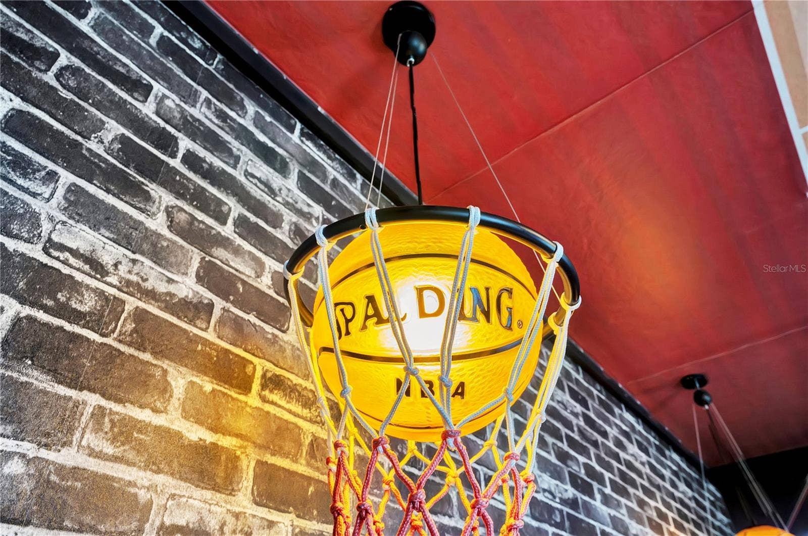 7704 WESTLAND DRIVE, Kissimmee, FL 34747 Even the lighting gets in the game! Custom basketball-inspired details complete The 23 Experience