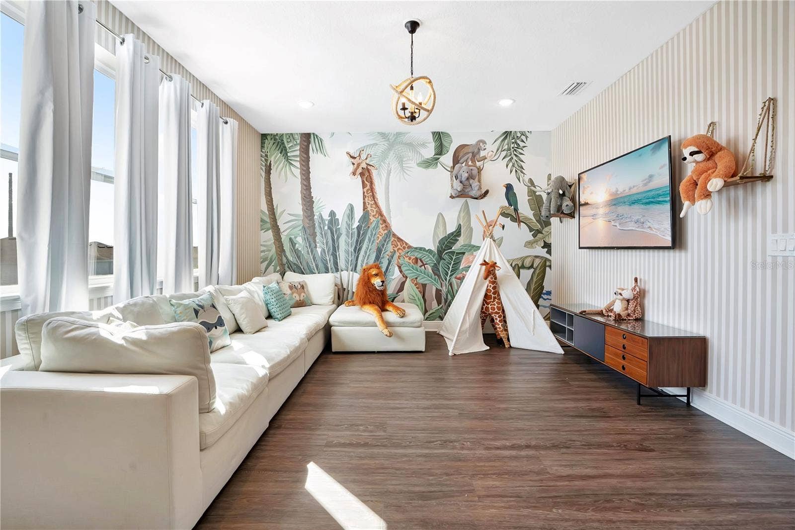 7704 WESTLAND DRIVE, Kissimmee, FL 34747 The Jungle Book Lounge - a whimsical upstairs retreat with colorful murals and inviting seating