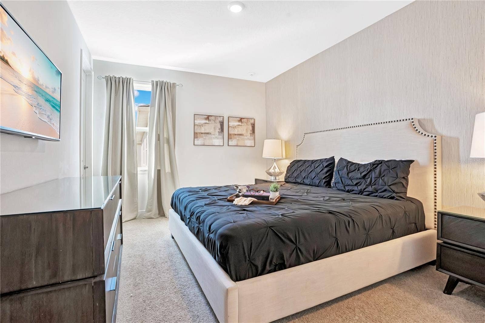 7704 WESTLAND DRIVE, Kissimmee, FL 34747 Another primary suite featuring sophisticated styling and beautifully coordinated furnishings