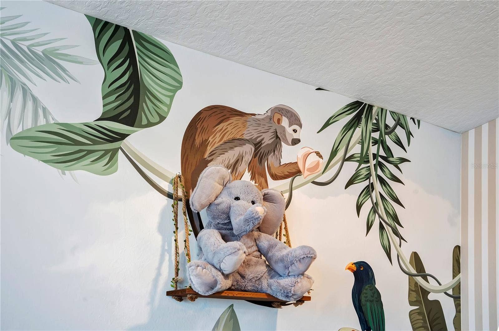 7704 WESTLAND DRIVE, Kissimmee, FL 34747 Beautifully illustrated jungle-inspired murals add personality and imagination