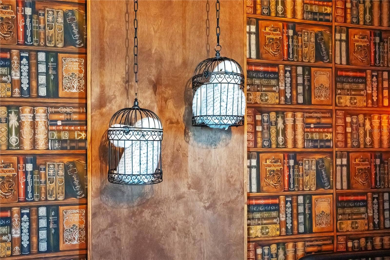 7704 WESTLAND DRIVE, Kissimmee, FL 34747 Step into the story. Enchanting library-inspired wallpaper and whimsical lighting create a world of imagination