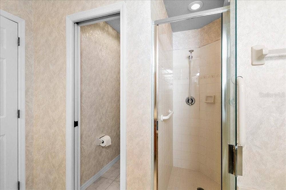 water closet and separate shower in primary bedroom