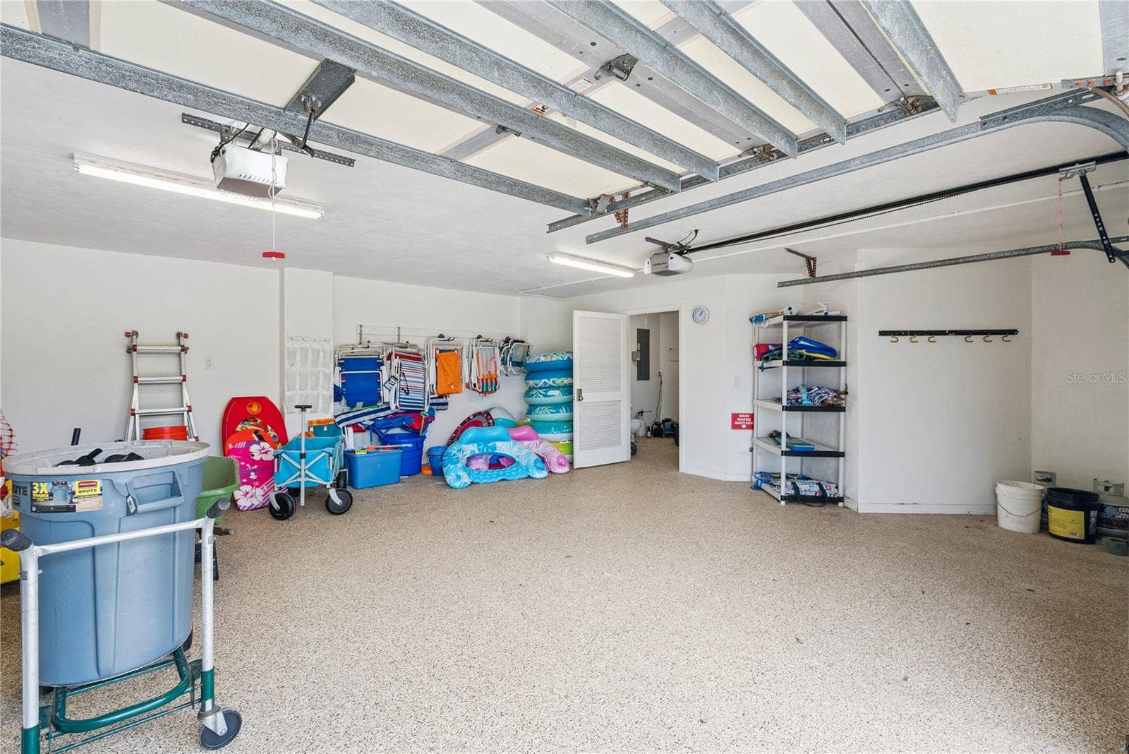 Garage: Attached garage with an extra dryer and plentiful pool and beach toys.