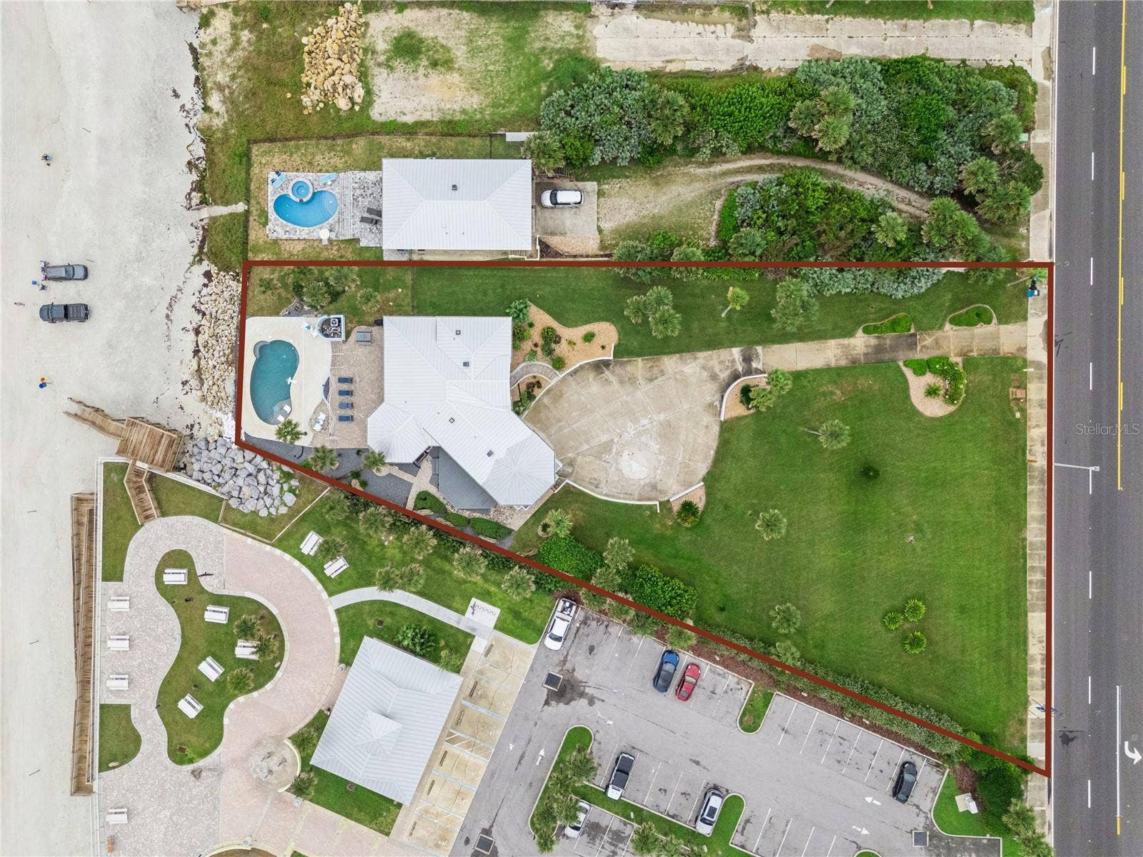 Set on over three-quarters of an acre with approximately 85 feet of ocean frontage, this property offers a generous setback from the road, ample driveway parking, and an attached garage. Neighboring Frank Rendon Park features a playground, covered picnic areas, restrooms, public beach access, and parking.