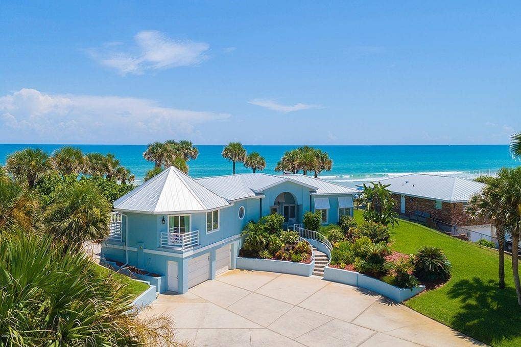Set on over three-quarters of an acre with approximately 85 feet of ocean frontage, this property offers a generous setback from the road, ample driveway parking, and an attached garage. Neighboring Frank Rendon Park features a playground, covered picnic areas, restrooms, public beach access, and parking