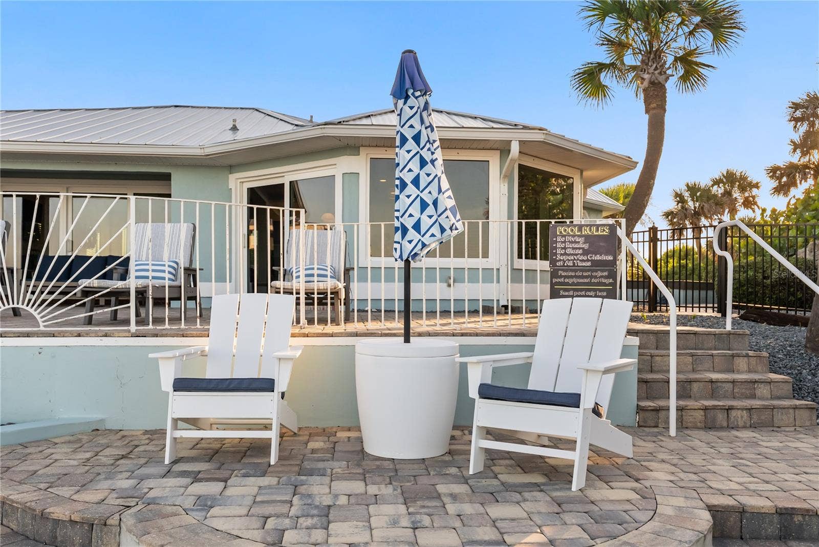 new poolNew oceanfront pool installed in 2024, featuring heating, a sun shelf, bubblers, and a 7-foot-deep end, with expansive patio space and panoramic Atlantic views.
