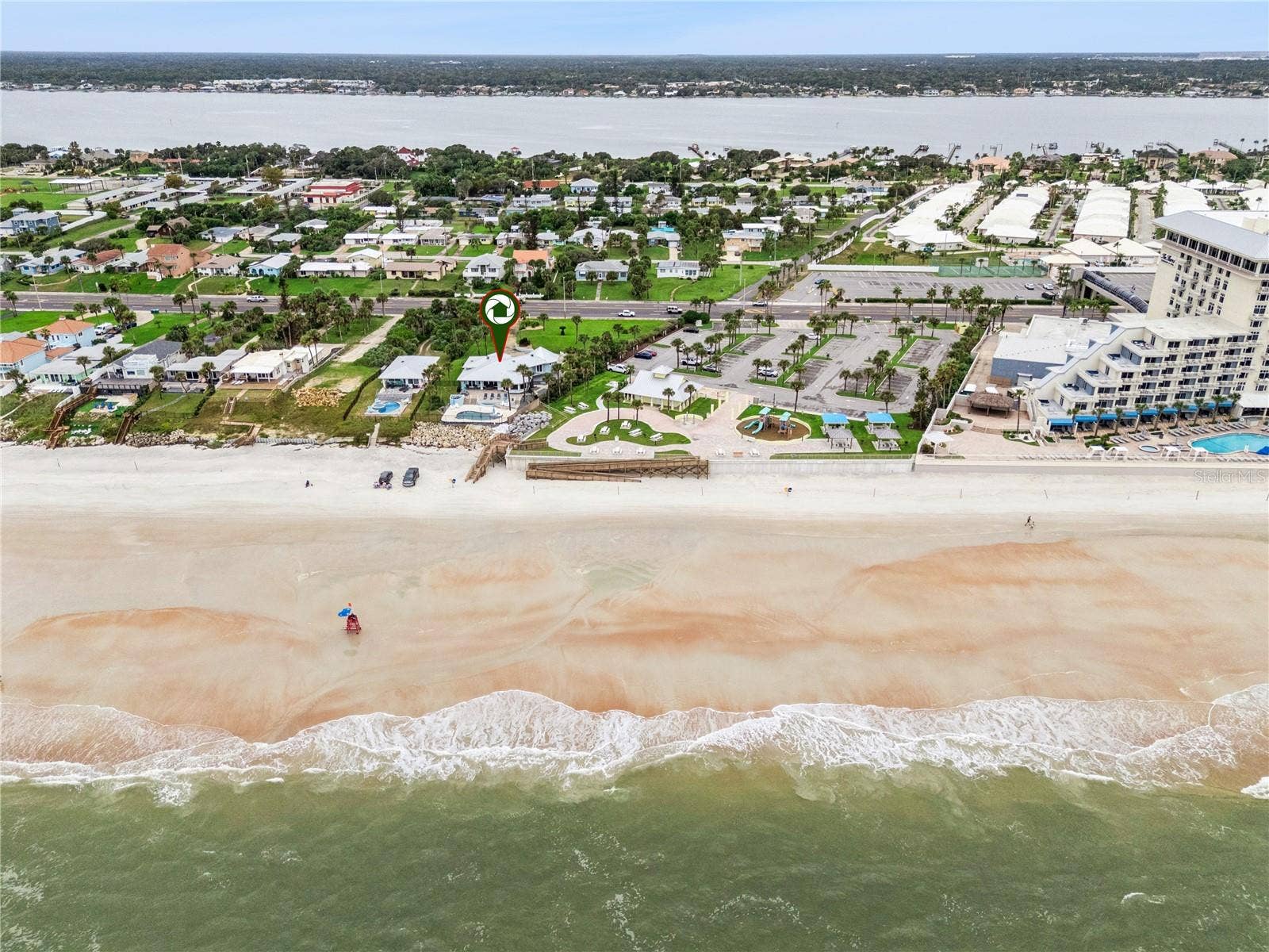 Set on over three-quarters of an acre with approximately 85 feet of ocean frontage, this property offers a generous setback from the road, ample driveway parking, and an attached garage. Neighboring Frank Rendon Park features a playground, covered picnic areas, restrooms, public beach access, and parking.