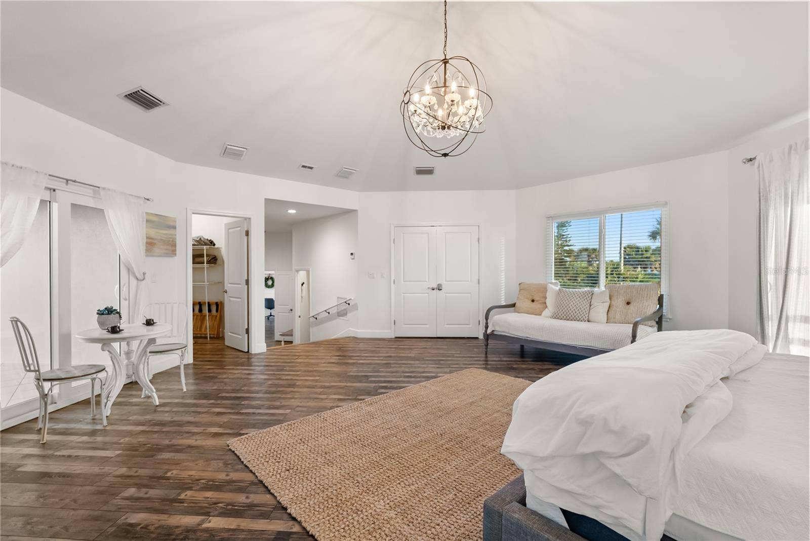 Primary suite: Spacious coastal retreat with ocean views, two large walk-in closets, and access to an oversized composite terrace overlooking the Atlantic