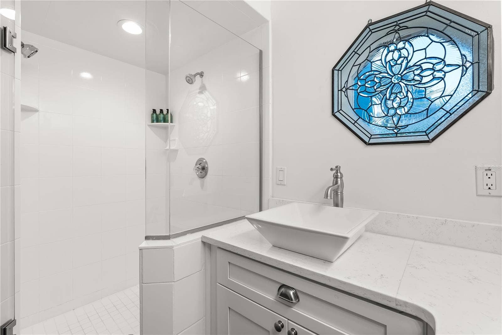 Master ensuite bathroom with updated finishes and statement window and skylight