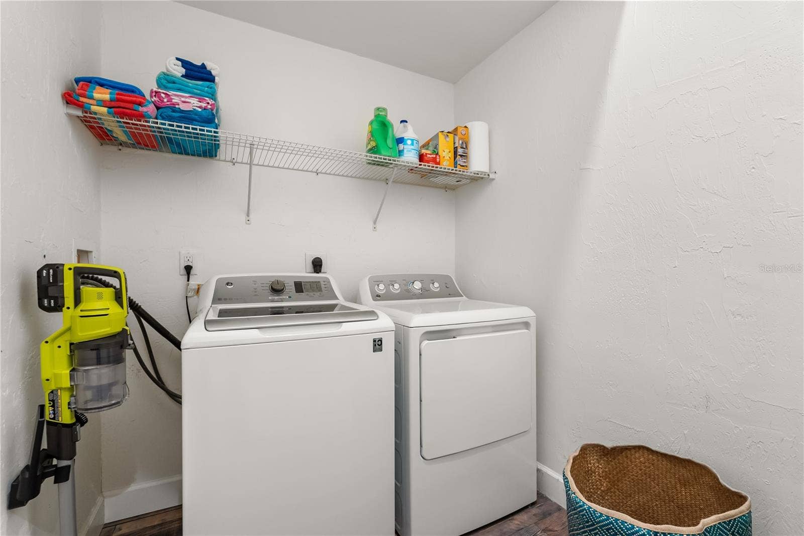 Main floor laundry room located at the entrance to the master bedroom suite and ensuite bathroom