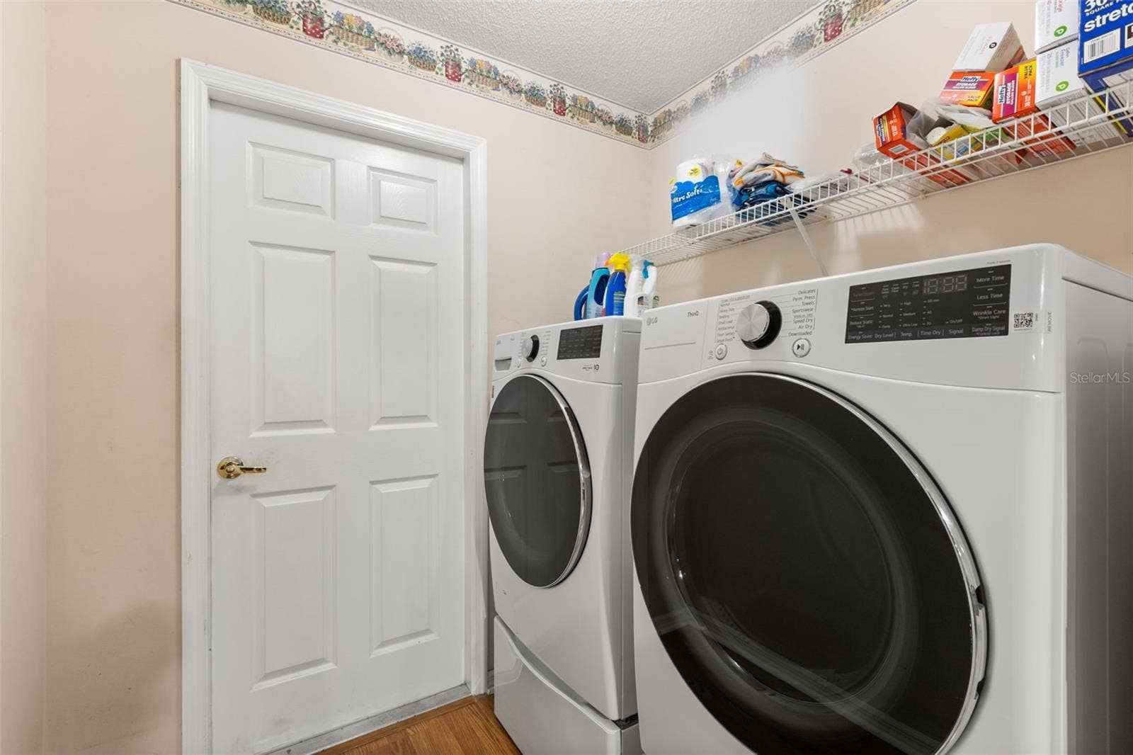 Inside laundry room. LG washer n dryer convey