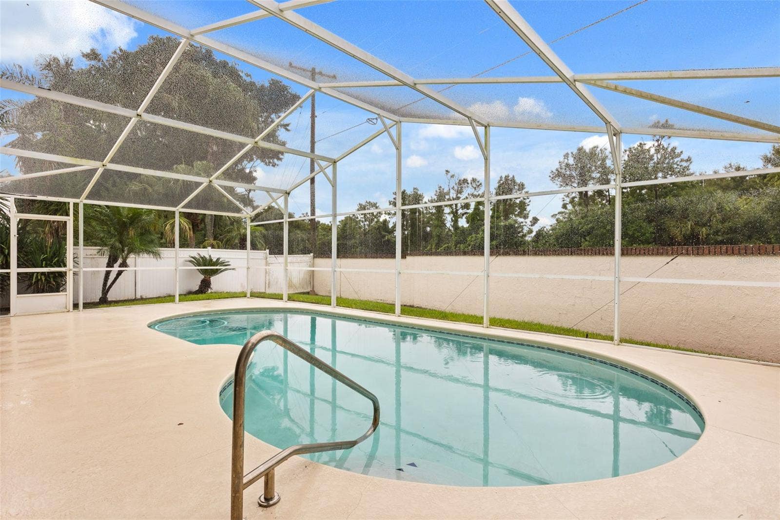 Recently resurfaced pool and re screened lanai.