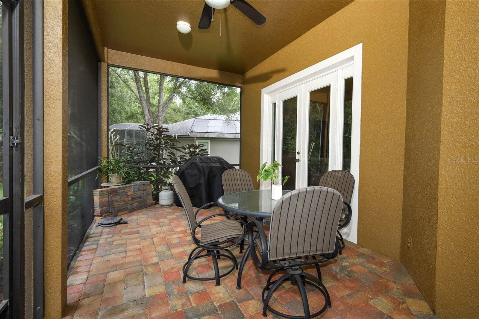 Screened lenai with paver brick all the way to the Gazebo
