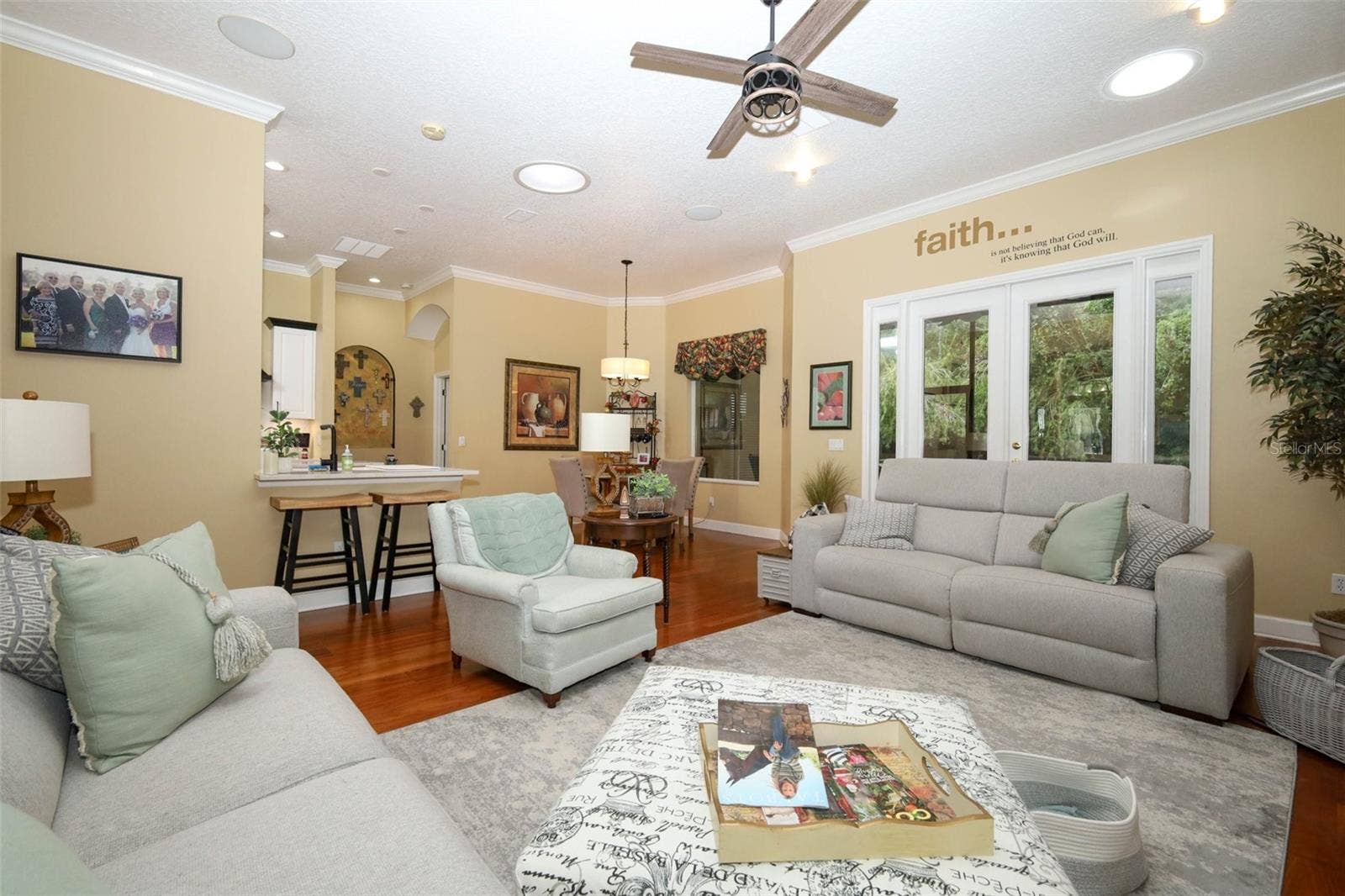 Family room looking in to breakfast nook and french doors leading to screened porch