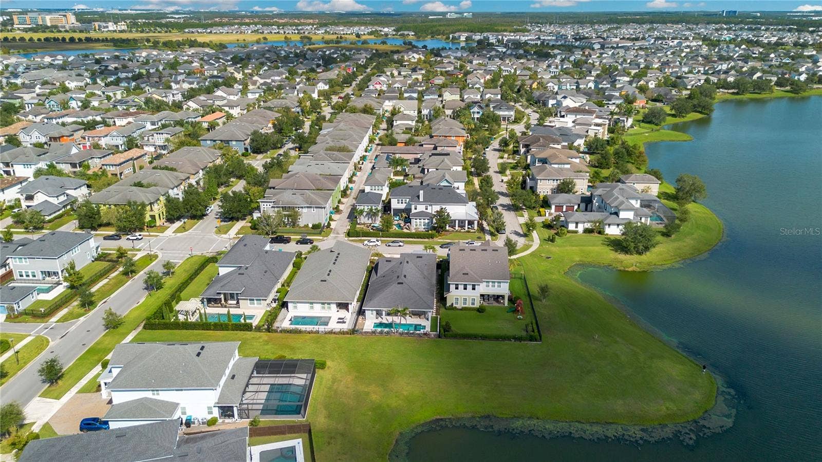 8336 CANETTI STREET, Orlando, FL 32827 Laureate Park community aerial with community pool, fitness center, dog parks, pickleball, and tennis nearby.