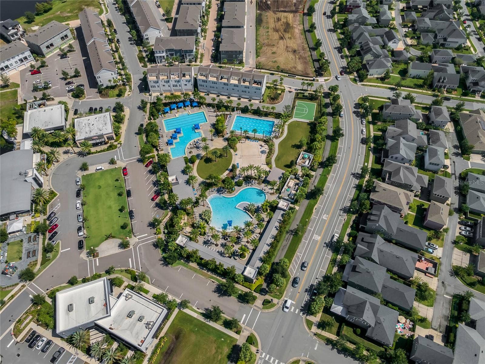 8336 CANETTI STREET, Orlando, FL 32827 Community pool complex surrounded by walkable neighborhood streets in Lake Nona.
