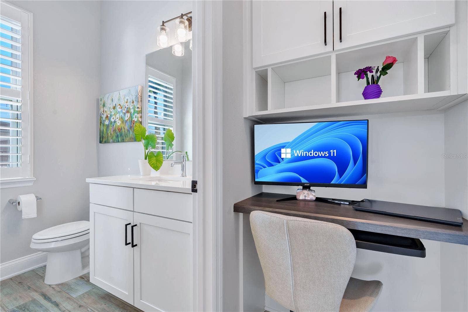 8336 CANETTI STREET, Orlando, FL 32827 Built in office nook with desk and shelving, a functional workspace for working from home.