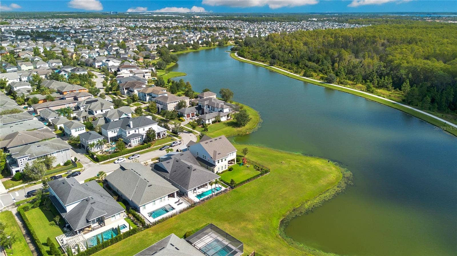 8336 CANETTI STREET, Orlando, FL 32827 Aerial view of Laureate Park, one of Lake Nona's most sought after communities, with lakes, trails, and parks.