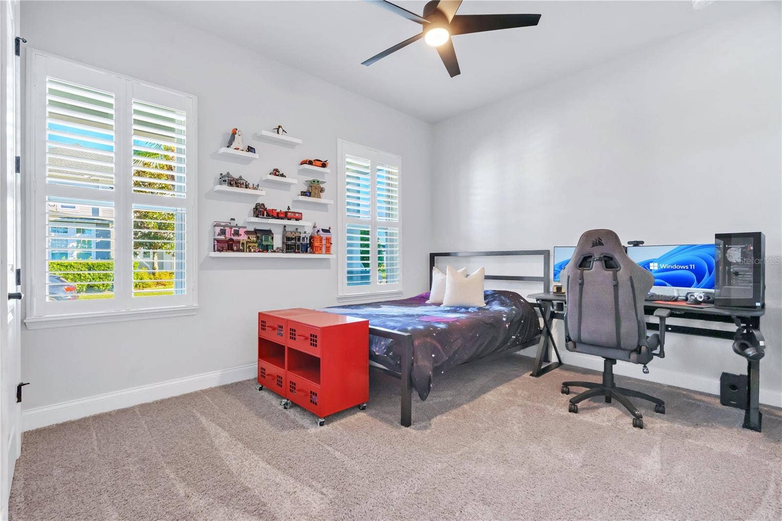 8336 CANETTI STREET, Orlando, FL 32827 Secondary bedroom with room for a desk, ceiling fan, and plenty of natural light.