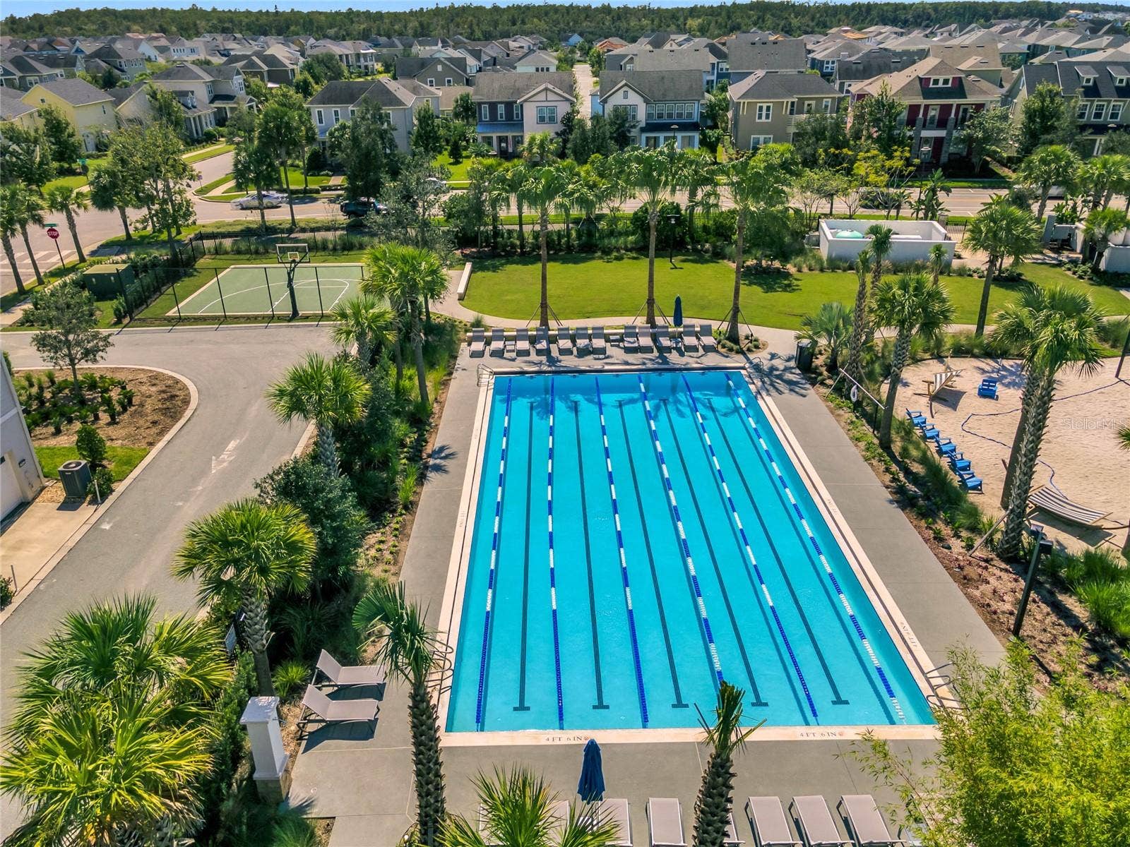 8336 CANETTI STREET, Orlando, FL 32827 Laureate Park lap pool for fitness swimming, part of the community's resort style amenities.