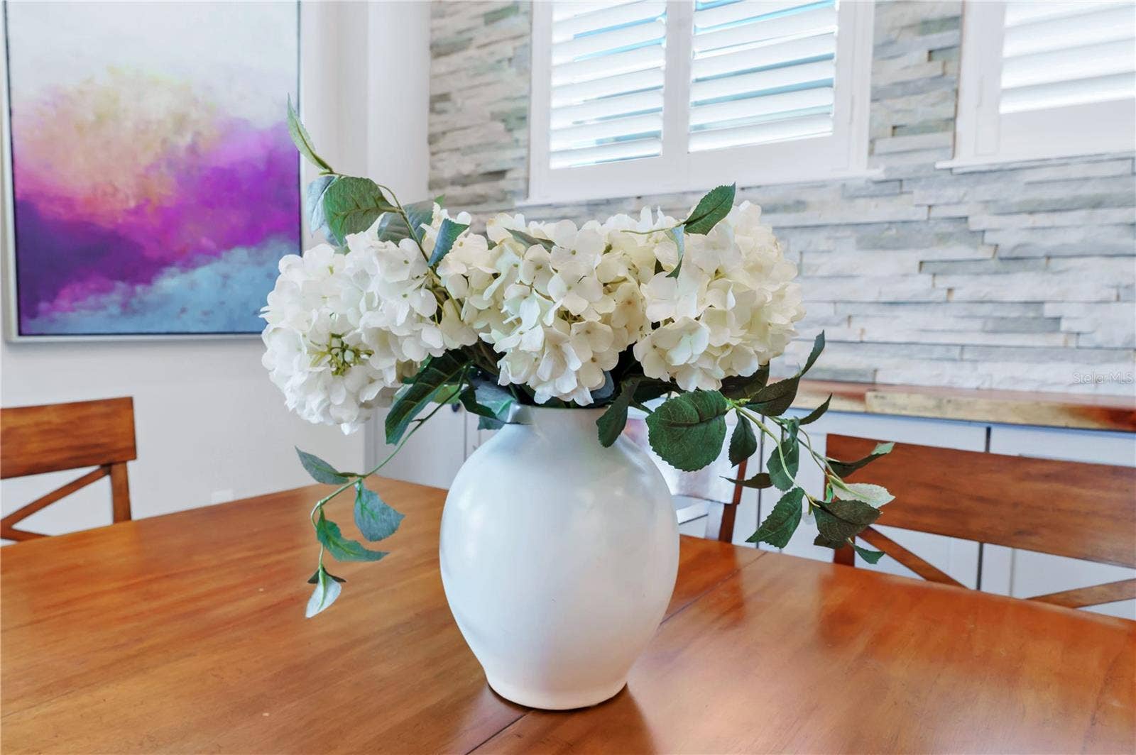 8336 CANETTI STREET, Orlando, FL 32827 Thoughtful finishes and natural light create a warm, welcoming dining space.