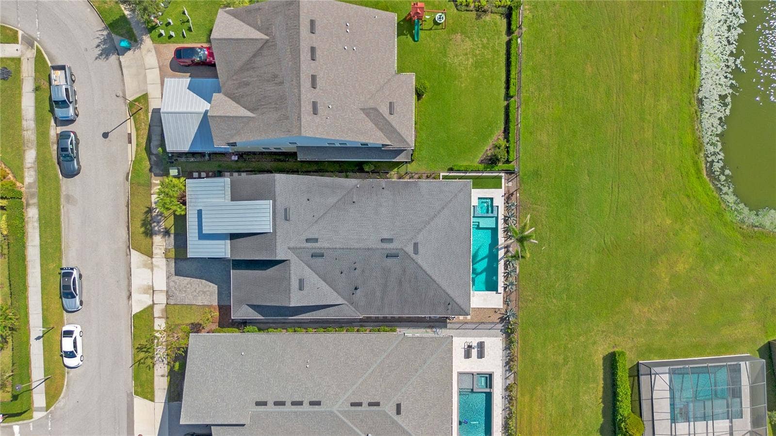 8336 CANETTI STREET, Orlando, FL 32827 Overhead aerial showing the home, private pool, and fenced backyard.