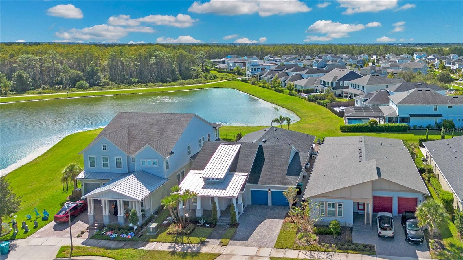 8336 CANETTI STREET, Orlando, FL 32827 Aerial view of the home and pond frontage in Laureate Park, Lake Nona, Orlando FL 32827.