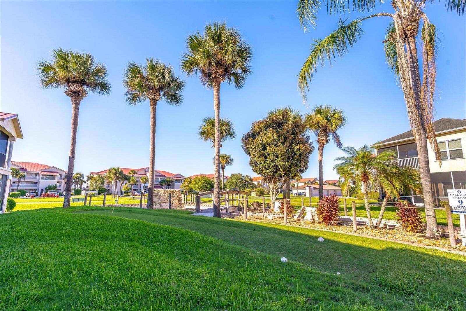 406 BOUCHELLE DRIVE, #103, New Smyrna Beach, FL 32169 green area behind unit