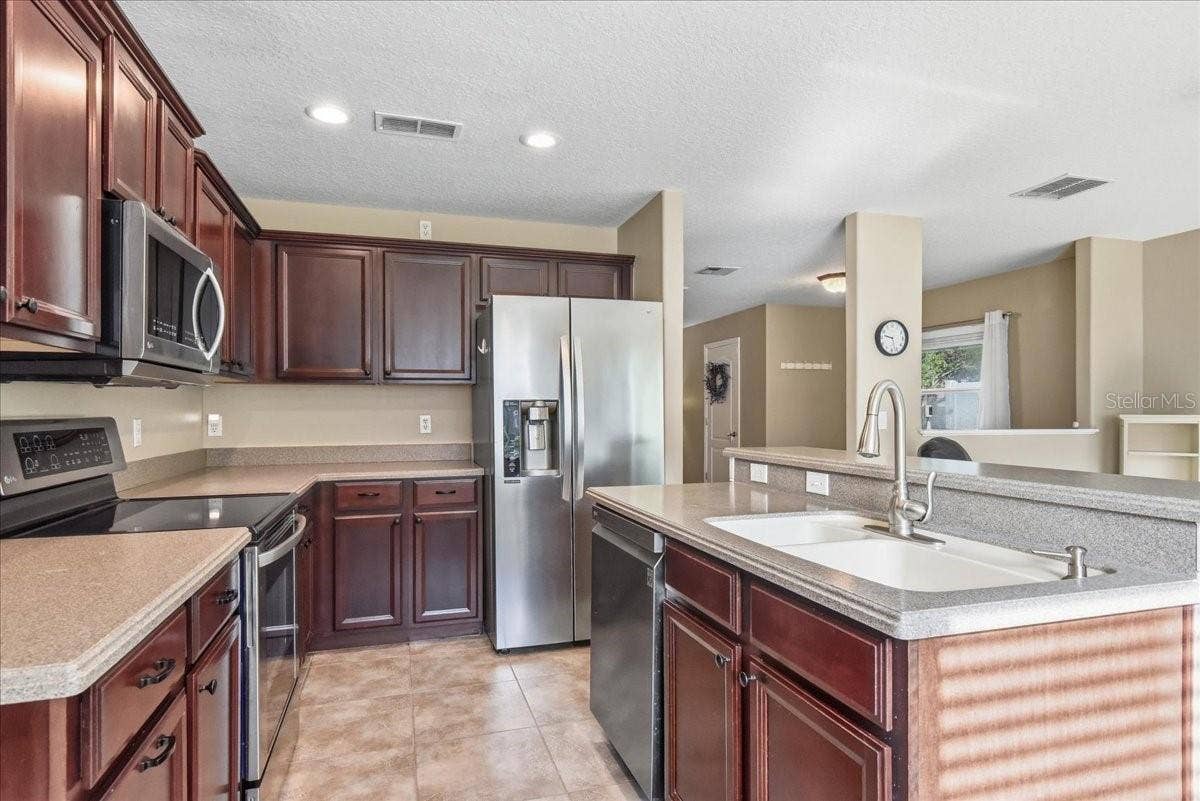 kitchen - Corian counters with integrated sink
