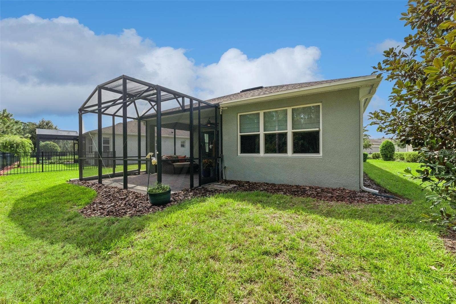 1305 HAYTON AVE., Deland, FL 32724 View of the screen enclosed Lanai & spacious backyard